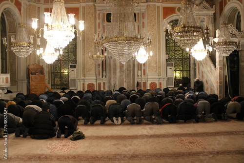 Muslims praying together in the mosque. tarawih or friday prayer
 photo