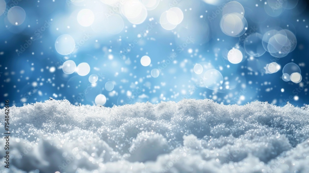 Fototapeta premium A close-up of glistening snowflakes against a soft-focus blue winter backdrop.