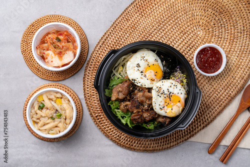 Korean food, bulgogi, bibimbap, beef, vegetables, eggs, side dishes, kimchi, fried tofu, red pepper paste