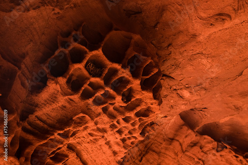 Red sandstones formations into the Foradada cave in the Areny mountain in Mont-Roig, Tarragona, Catalonia, Spain. Textures natural background. photo