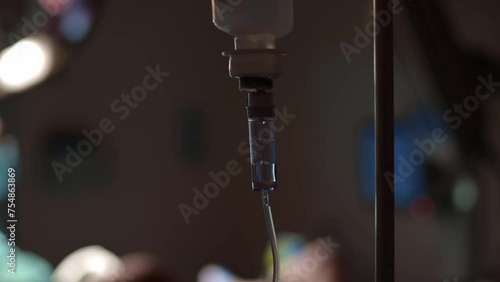 dropper with anesthesia dripping. the drug drips drop by drop, close-up