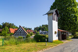 Bell tower and houses in village Herzogwind, district of Obertrubach (Franconian Switzerland), Bavaria, Germany