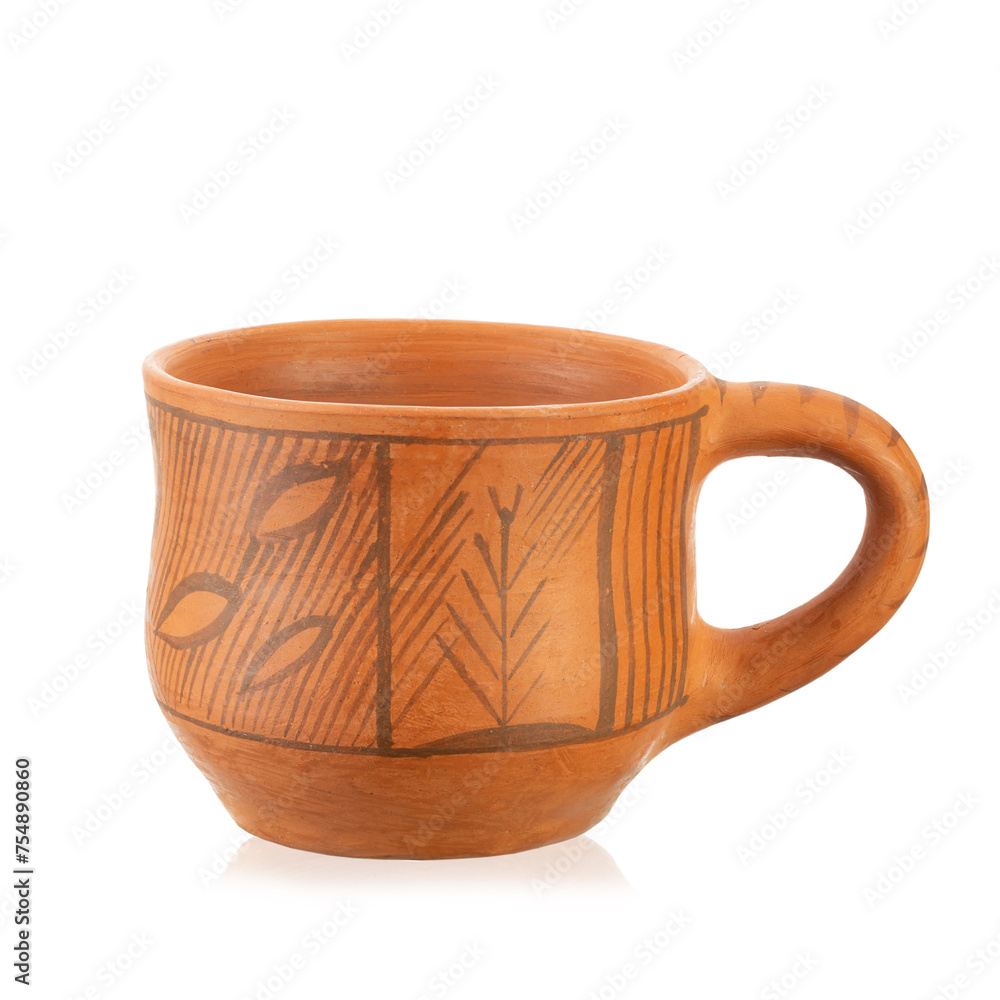Clay cup with an ornament. Country style. Isolated on white background. Clay cup with an ornament. Country style. Isolated on white background.