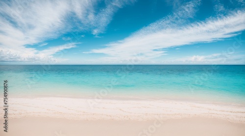 Quiet coast featuring clear waters fine white sands and light clouds under a blue sky 