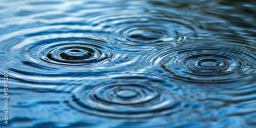 Pristine concentric ripples on a tranquil water surface, capturing the serene moment of a raindrop's impact.