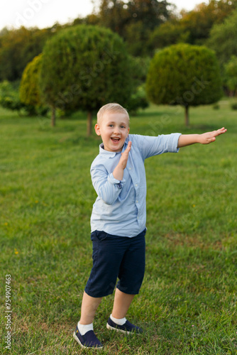A child playing in the park, isolated tree background.
