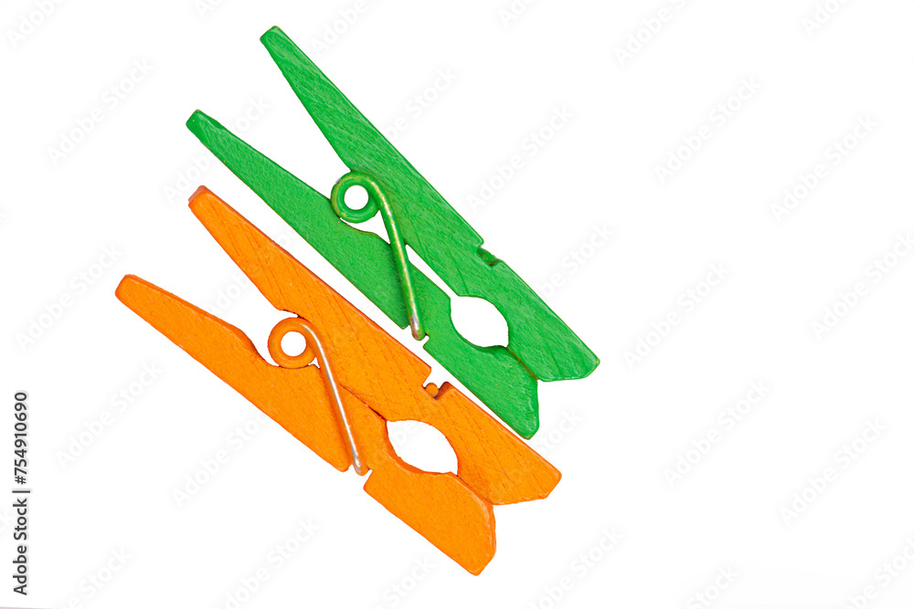 Colored clothespins on a white background. Colored clothespins on a white background.