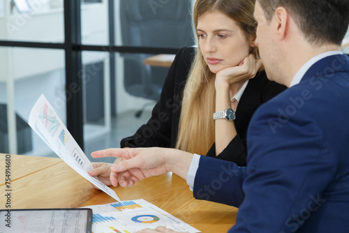 financial business and secretary team working analyst on stock market exchange technical graph trend. Investor businessman talking with research team in risk and investing report. photo