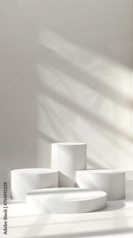 Fototapeta premium White cylindrical podiums in a minimalist setting with elegant shadow play, ideal for product display and contemporary design.