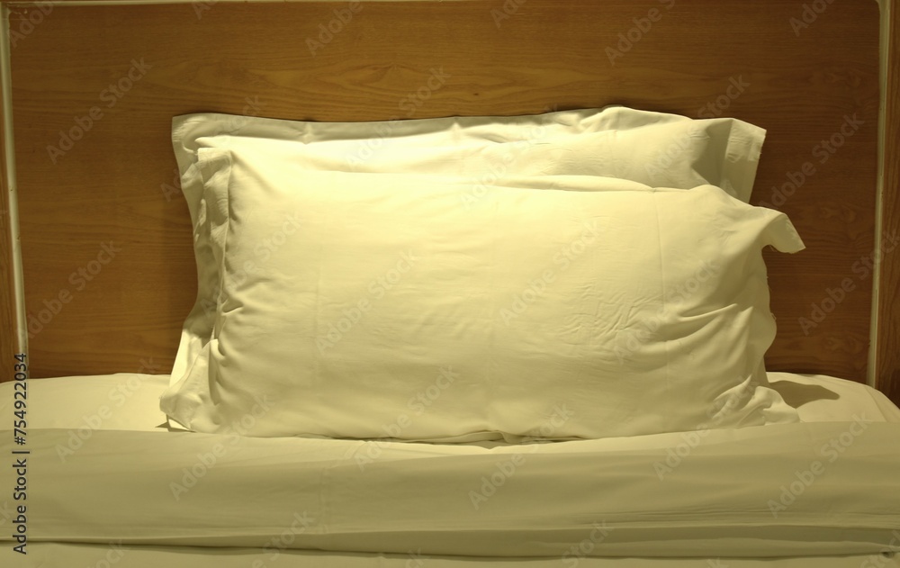 two pillow and blanket opened for one people on single bed in night two pillow and blanket opened for one people on single bed in night