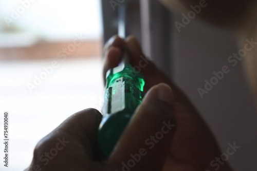 a woman screwing with a screwdriver