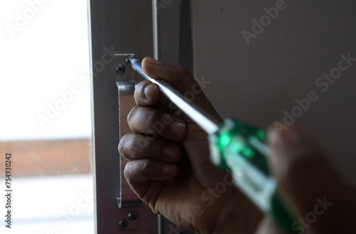 a woman screwing with a screwdriver