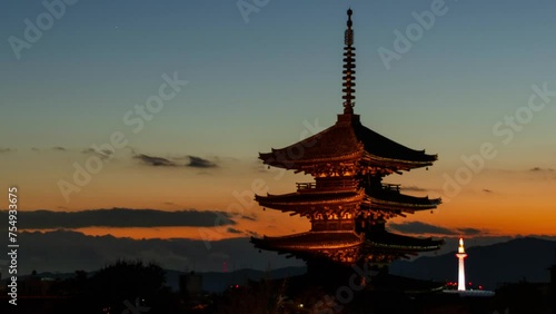 timelapse kyoto city aerial skyline view to ancient Yasaka pagoda building and Kyoto Tower at the back in higashiyama, Kyoto old town with sunset sky photo