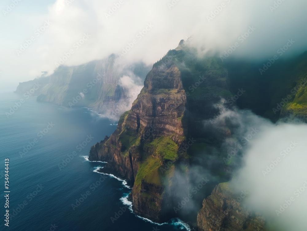 A breathtaking view of towering sea cliffs wrapped in mist, showcasing nature's grandeur and mystery.