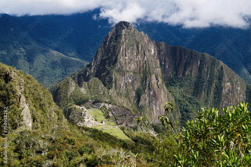 Fototapeta premium A panoramic view of the very famous Machu Picchu, the 15 th century Inca citadel located in the Andes of Peru, above the Urubamba River valley, designated a UNESCO World Heritage Site in 1983