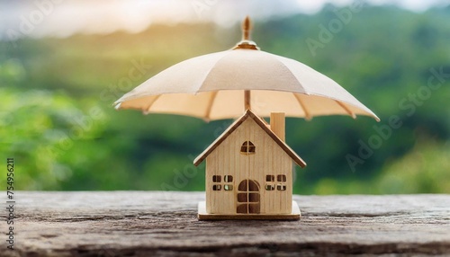 Guardian Roof: Symbolizing Security and Assurance with a Wooden House Model under an Umbrella" © Sadaqat
