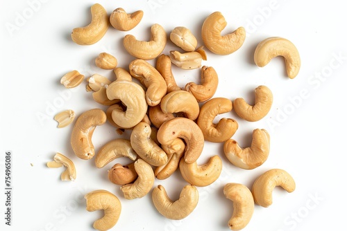 Pile of whole cashews arranged on white background