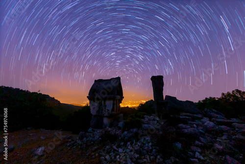 Night astro photos of an ancient tomb in the ancient city of Xanthos, Antalya, Türkiye photo
