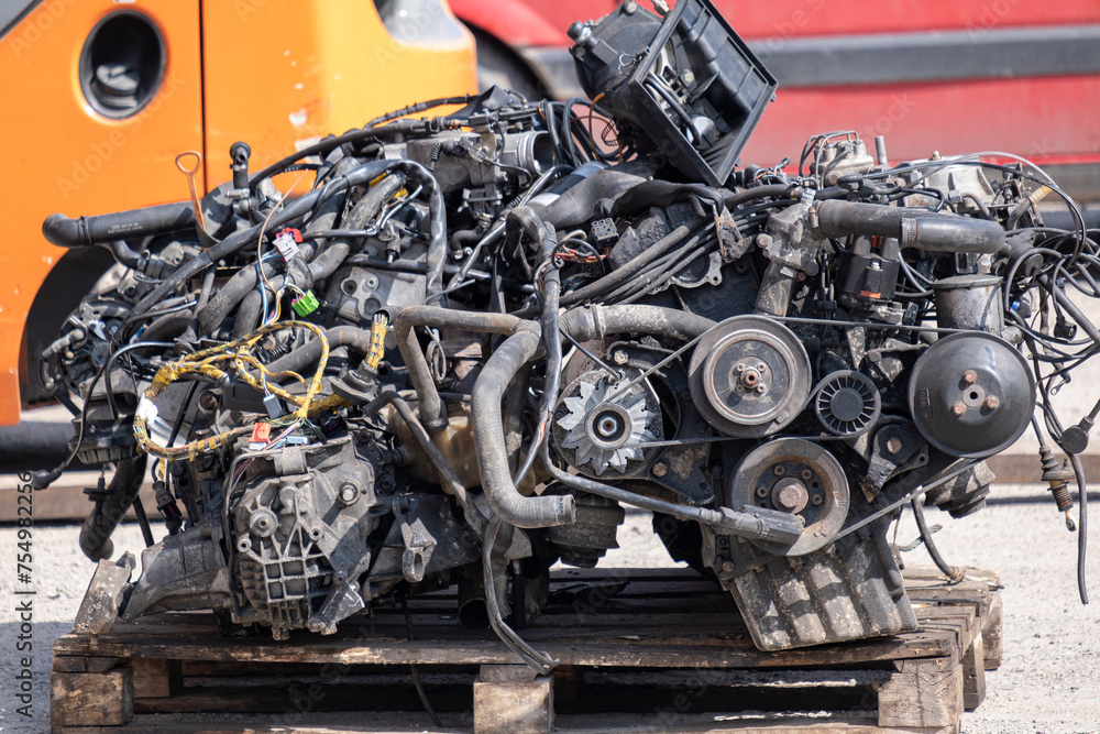 The car engine is for sale at the car disassembly center. The car engine is for sale at the car disassembly center.