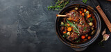 Braised lamb shank with herbs and vegetables