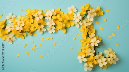 A composition of yellow flowers. Flowers on a blue background. The concept of spring  summer  top view  place for text. An invitation card.