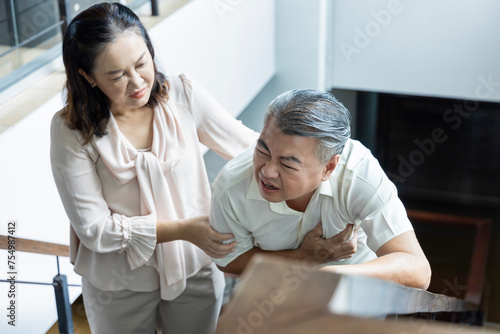Asian Senior Couple Dealing with Heart Attack Problem, senior couple, husband and wife staying together with support and care concept