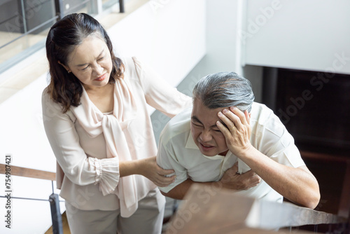 Asian Senior Couple Dealing with stroke, headache, stress, dementia concept; senior couple, husband and wife staying together with support and care