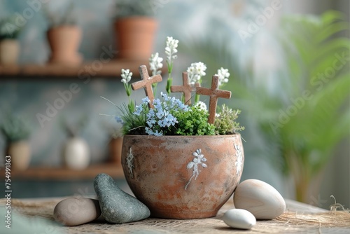 A DIY Resurrection Garden representing the Easter story, with three rustic crosses, fresh spring flowers, and symbolic stones.
