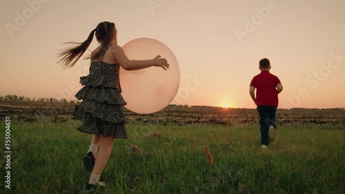 girl boy child running into sunset with ball hands, children running lawn, happy family dream, video must watch, source inspiration, heart child lies key eternal peace earth, world dreams, desire fly