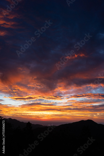 Beautiful Colorful Cloudy Sunrise Over Mountains in Boulder, Colorado © Jenna