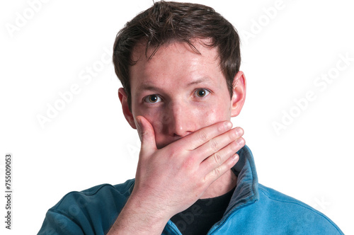 Man covers his mouth with right hand