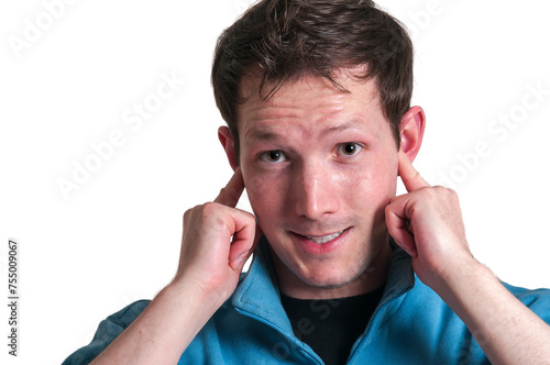 Man puts fingers in his ears