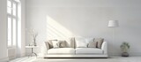 A white sofa with cushions is the focal point of a living room, paired with a modern lamp casting a soft glow. The Scandinavian interior design features clean lines and a minimalist aesthetic.