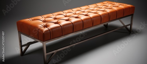 A top-down view of a brown leather bench with a capitone design on a sturdy steel frame. The bench is elegantly crafted, combining comfort with modern aesthetics. photo