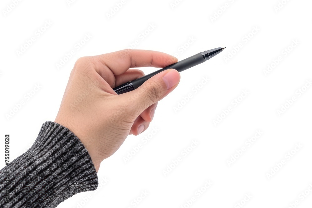 A hand holding a pen with a black tip. The pen is pointed at the camera. Concept of focus and determination