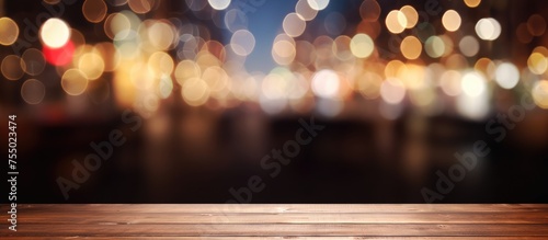 A dark wooden table is showcased in front of a blurred background filled with twinkling lights. The table provides a simple yet elegant backdrop for products or items to be displayed or photographed.
