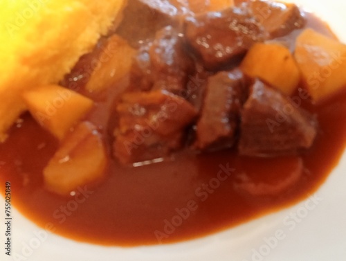 Stewed beef stew with carrots and potatoes. typical food from northern Italy