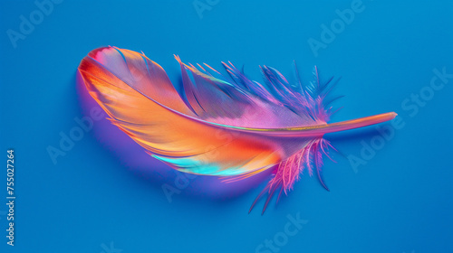 Neon-colored, holographic feather on a blue background. A single feather with an electrifying and colorful spectrum stands out against a solid blue backdrop, invoking themes of lightness and freedom