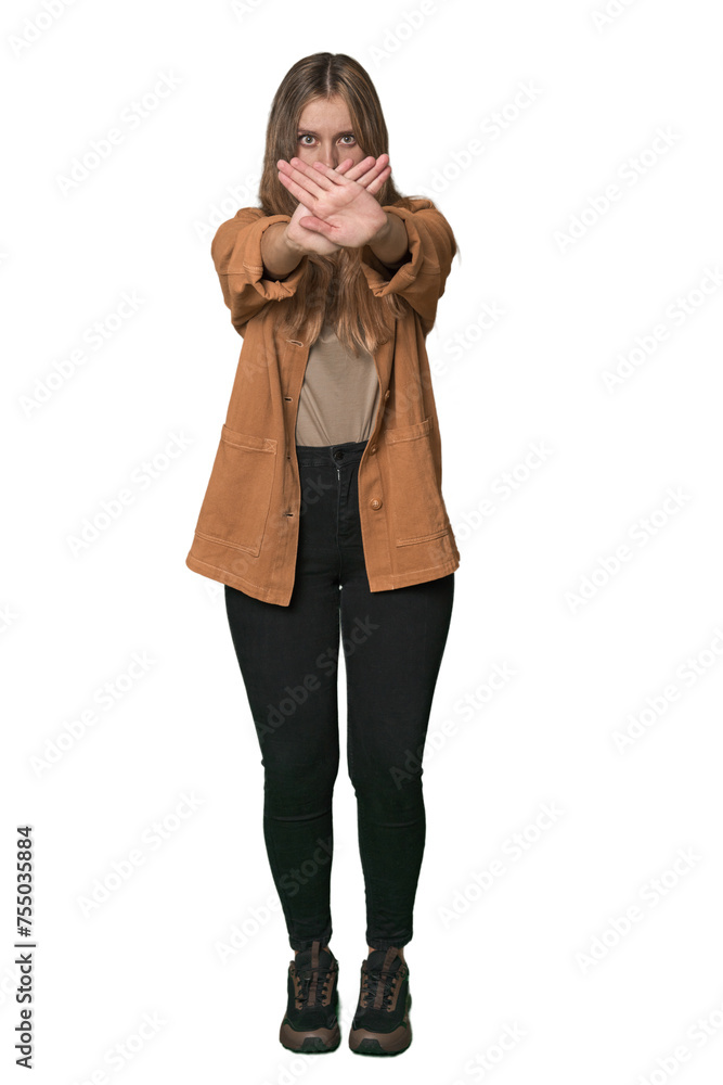 Studio portrait of a blonde Caucasian woman doing a denial gesture Studio portrait of a blonde Caucasian woman doing a denial gesture