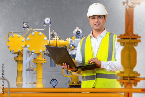 Man engineer. Worker near g...