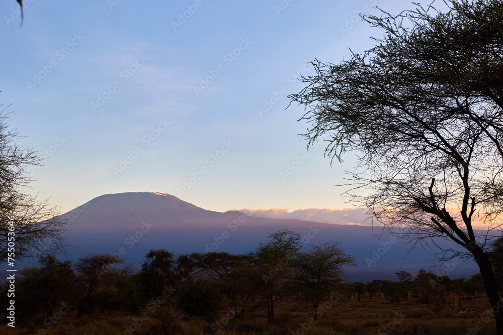 Sunset with clear view of Mount Kilimanjaro in the background. Sunset with clear view of Mount Kilimanjaro in the background.