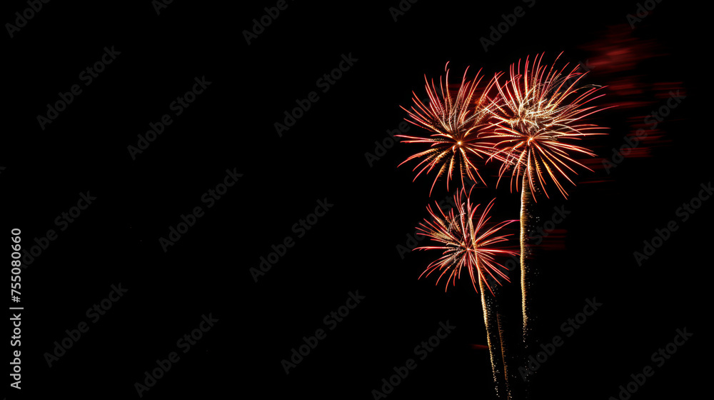Vibrant red fireworks burst in a dark sky, a dazzling display of light against the contrasting dark backdrop Vibrant red fireworks burst in a dark sky, a dazzling display of light against the contrasting dark backdrop