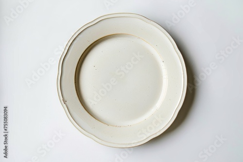 A white plate resting on a white table  showcasing minimalistic design and clean aesthetics