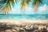 A blurred scene of a beach featuring a single palm tree swaying in the wind.