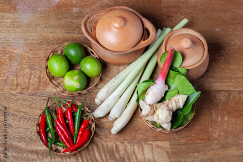 tom yum spicy soup ingredient on wooden rustic background