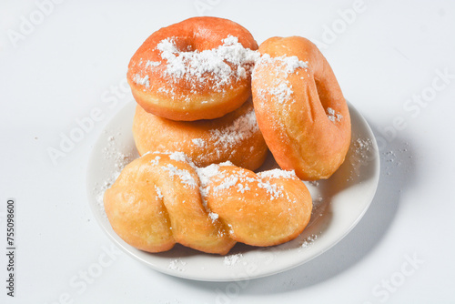 Close up of original donuts without toppings on a white background. Isolated objects