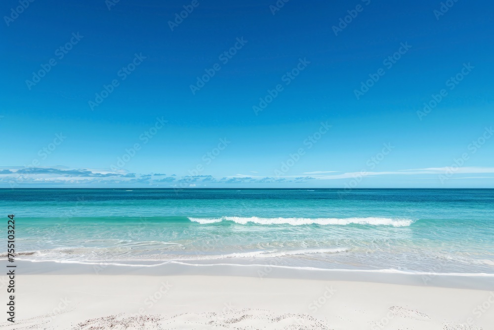 A panoramic view of a coastal paradise with a white sandy beach and clear blue skies.