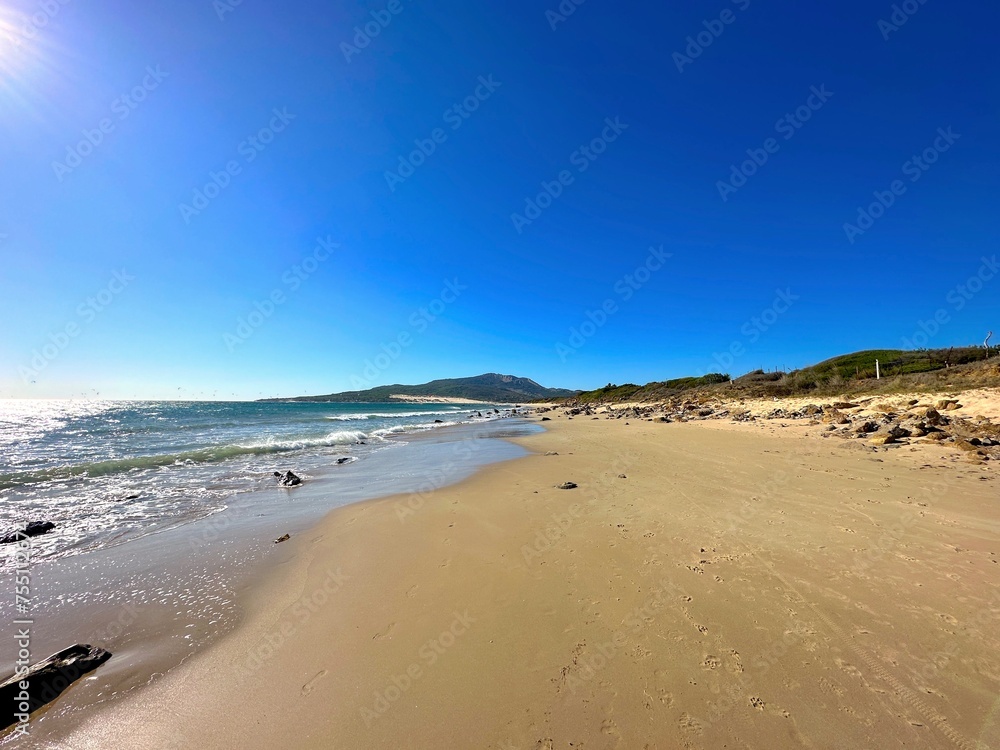 view of the beach Playa Valdevaqueros at the Atlantic Ocean, the high sand dune of Valdevaqueros in the background, Costa de la Luz, Andalusia, Spain