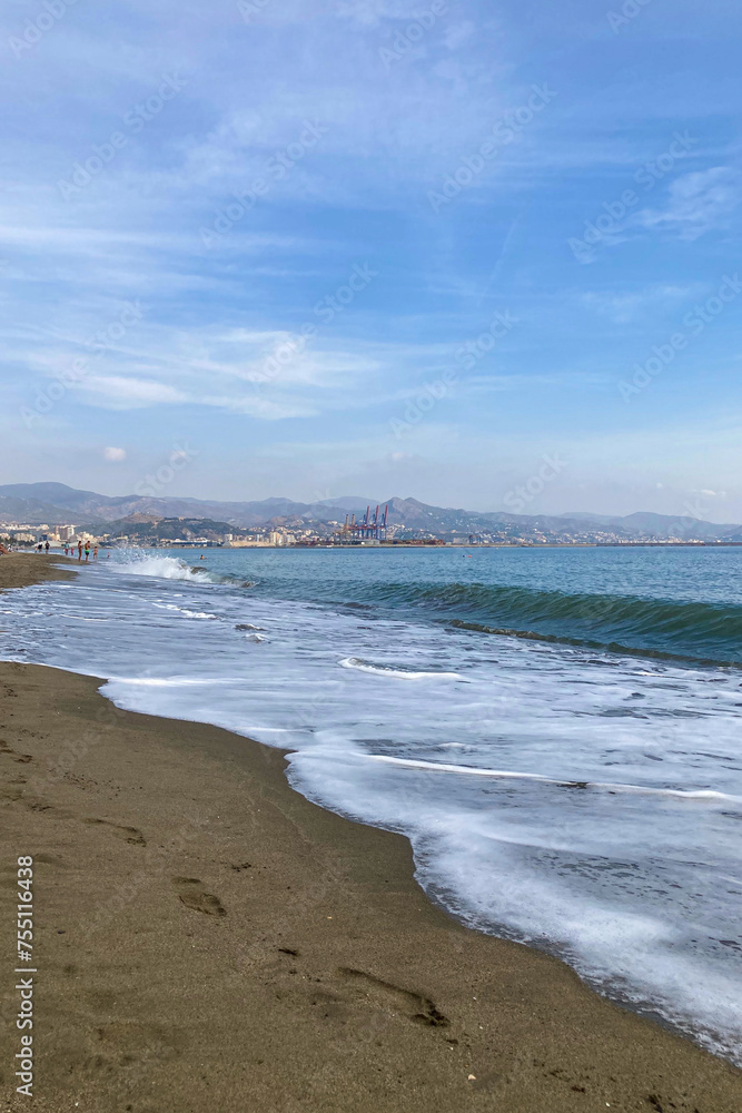 Morning walk on sea promenade in Malaga, Costa del sol, Spain Morning walk on sea promenade in Malaga, Costa del sol, Spain