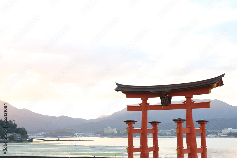 Famous red torii (shinto shrine gates) of the Itsukushima Shrine on sunset, Miyajima, Japan. High quality photo Famous red torii (shinto shrine gates) of the Itsukushima Shrine on sunset, Miyajima, Japan. High quality photo